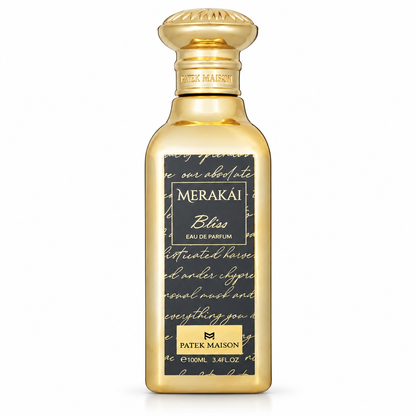 Botella dorada de Merakái Bliss de Patek Maison con etiqueta negra y letras doradas, sobre fondo blanco.